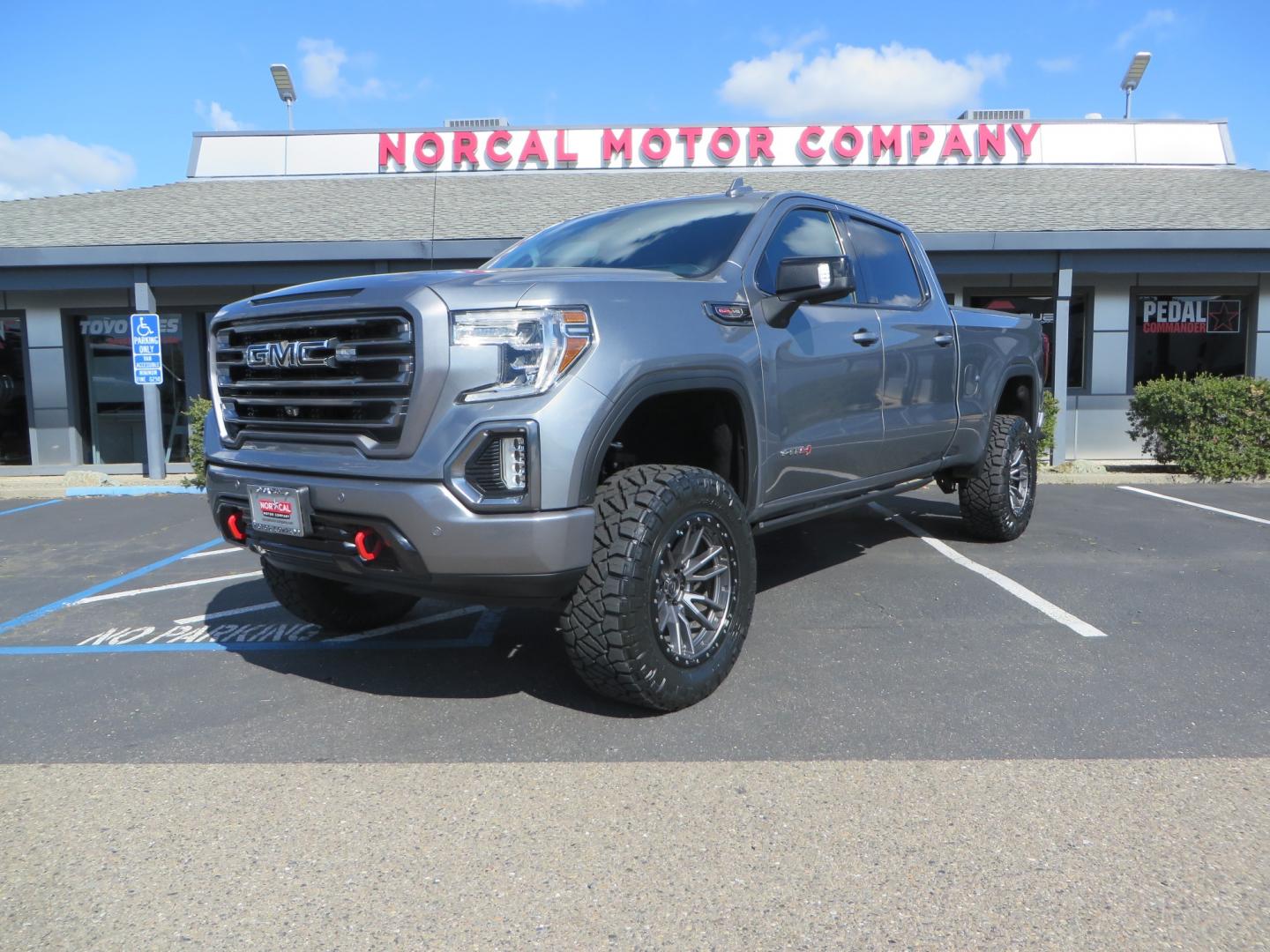 2019 CHARCOAL /BLACK GMC Sierra 1500 AT4 Crew Cab Long Box 4WD (1GTP9EEL6KZ) with an 6.2L V8 OHV 16V engine, 6A transmission, located at 2630 Grass Valley Highway, Auburn, CA, 95603, (530) 508-5100, 38.937893, -121.095482 - Dont miss this AT4 featuring a 4" RC lift kit kit, 35" Nitto Ridge Grappler tires, 20" Fuel Rebel wheels, Amp POwer steps, Air Bags, and a Tyger Bed cover. - Photo#0